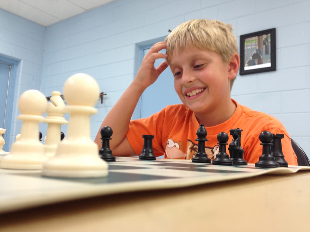 Kid playing chess